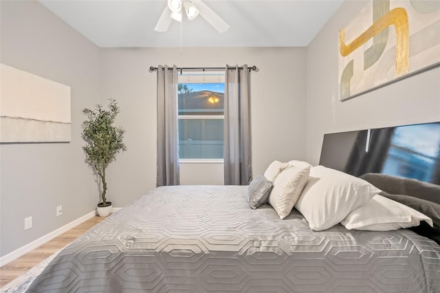 bedroom featuring ceiling fan and wood-type flooring