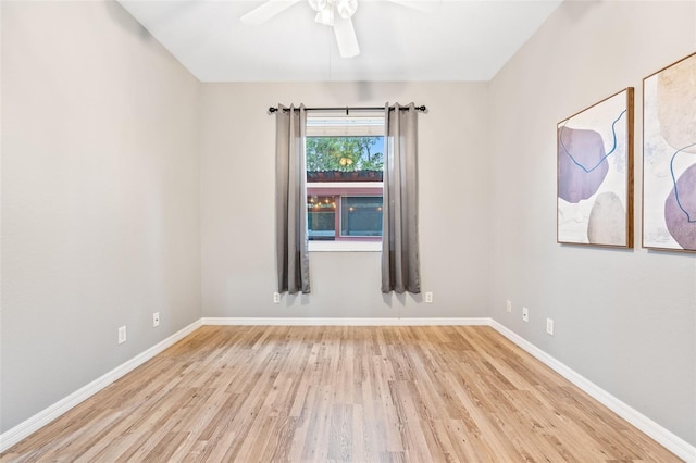 empty room with ceiling fan and light wood-type flooring