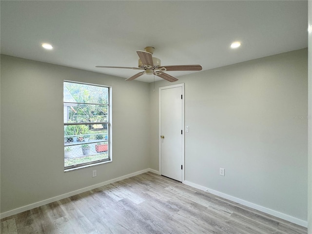 empty room with light hardwood / wood-style floors and ceiling fan