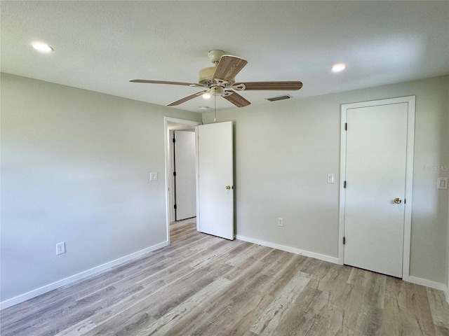 unfurnished bedroom with light hardwood / wood-style flooring and ceiling fan