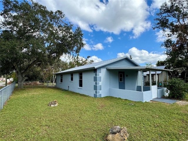 view of home's exterior with a lawn