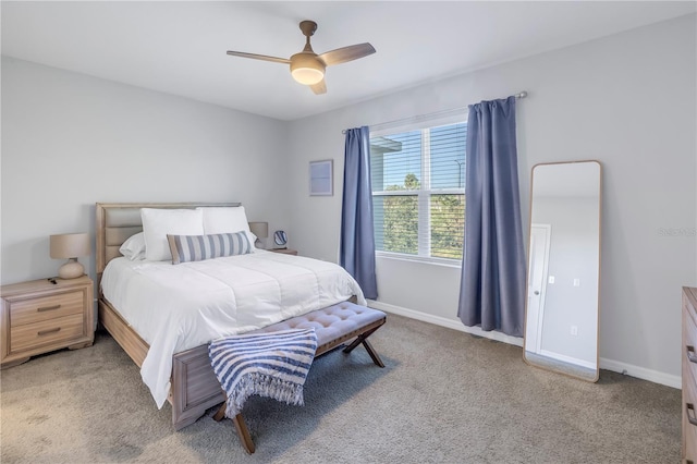 bedroom featuring ceiling fan and carpet