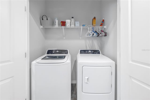 washroom with washing machine and clothes dryer