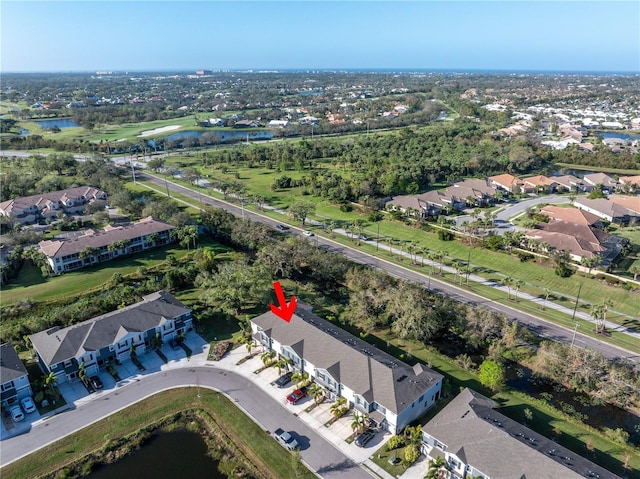 bird's eye view featuring a water view and a residential view