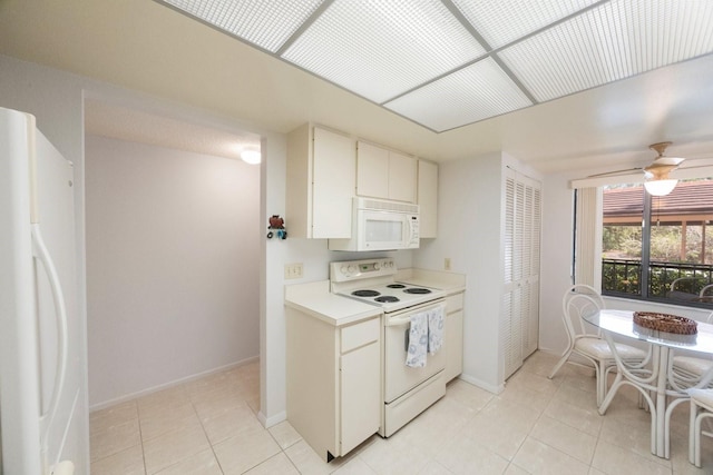 kitchen featuring white cabinetry, ceiling fan, light tile patterned floors, and white appliances