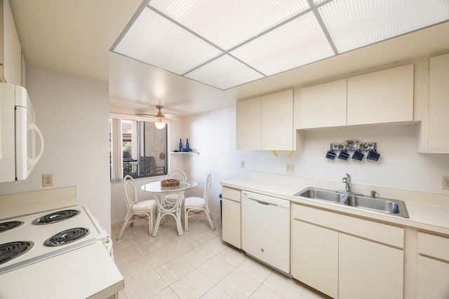 kitchen featuring light tile patterned floors, sink, white appliances, and ceiling fan