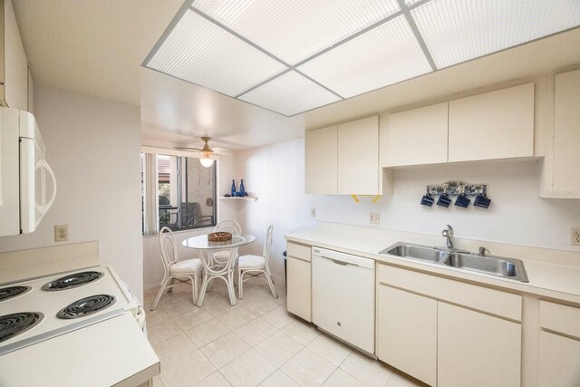 6435 Egret Ln Unit 409, Bradenton, FL 34210 - kitchen featuring a sink, white appliances, light countertops, a ceiling fan, and cream cabinetry