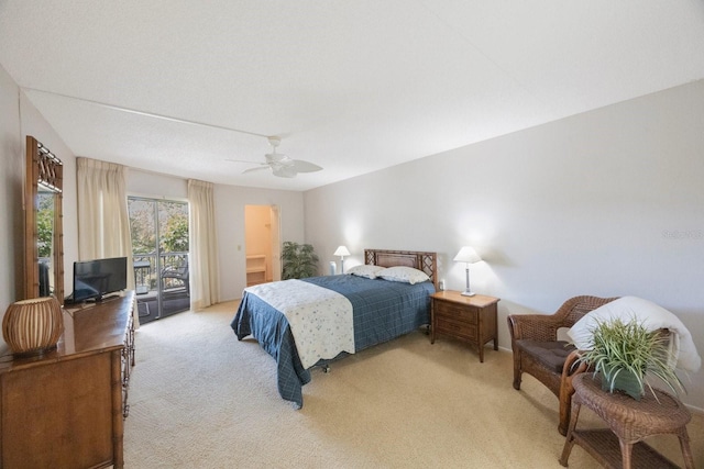 carpeted bedroom with ceiling fan and access to outside