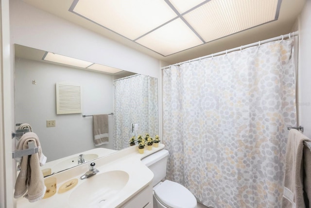 bathroom with vanity, toilet, and a shower with shower curtain