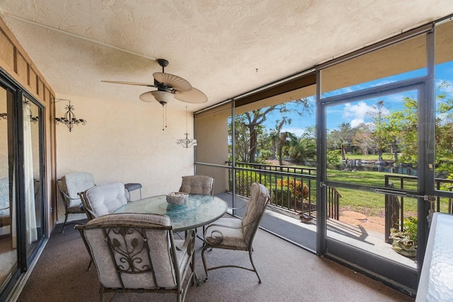 6435 Egret Ln Unit 409, Bradenton, FL 34210 - sunroom featuring a water view and ceiling fan