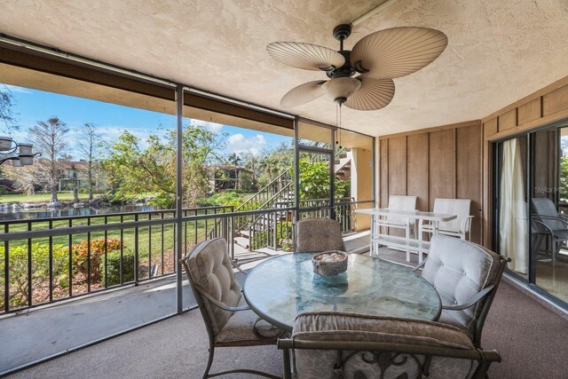 6435 Egret Ln Unit 409, Bradenton, FL 34210 - sunroom / solarium with a ceiling fan, outdoor dining space, and a water view