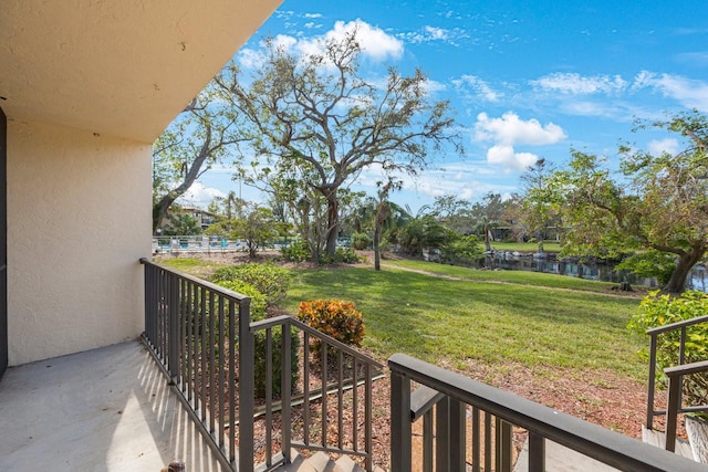 balcony featuring a water view