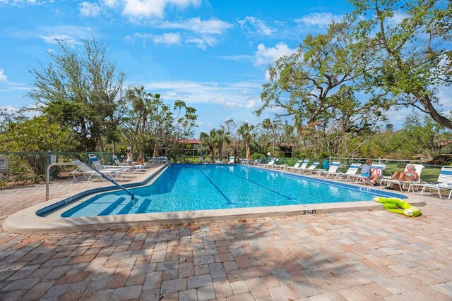 6435 Egret Ln Unit 409, Bradenton, FL 34210 - community pool with fence and a patio area