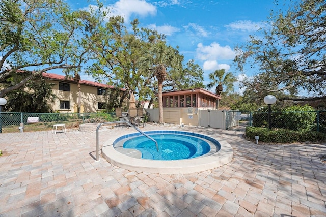 view of pool featuring a patio area and a community hot tub