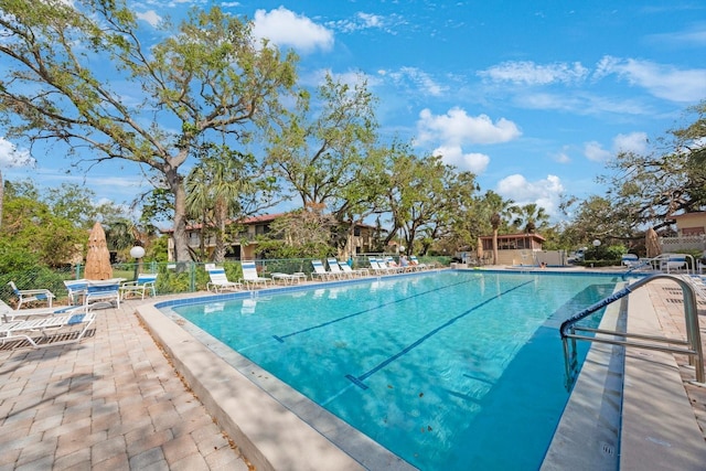 view of swimming pool with a patio area