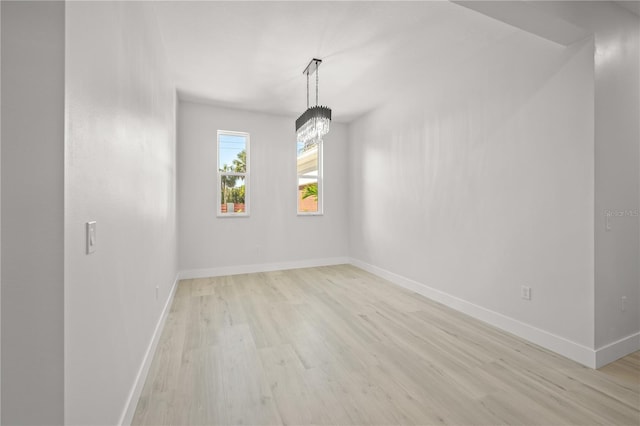 spare room with light wood-type flooring