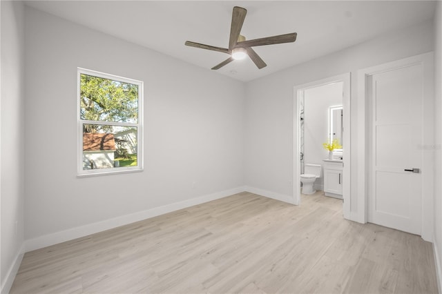 unfurnished bedroom featuring ceiling fan, light hardwood / wood-style flooring, and ensuite bath