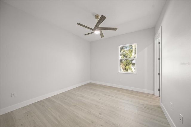 unfurnished room featuring ceiling fan and light wood-type flooring