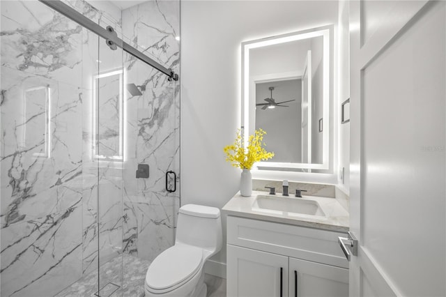 bathroom featuring toilet, an enclosed shower, and vanity