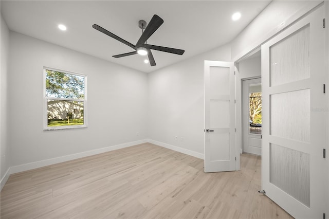 unfurnished bedroom featuring ceiling fan and light wood-type flooring