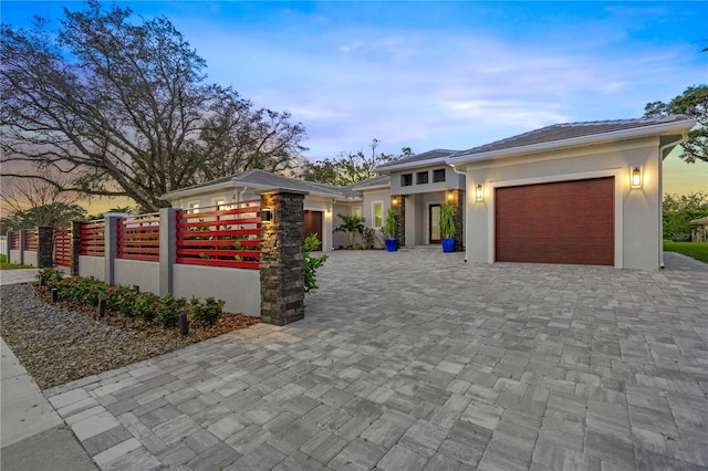 prairie-style house featuring a garage