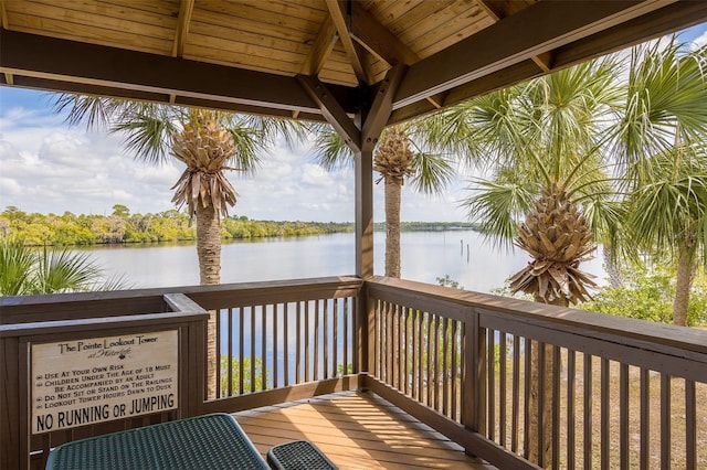 wooden deck featuring a gazebo and a water view