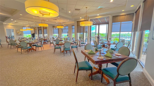 dining room with a drop ceiling