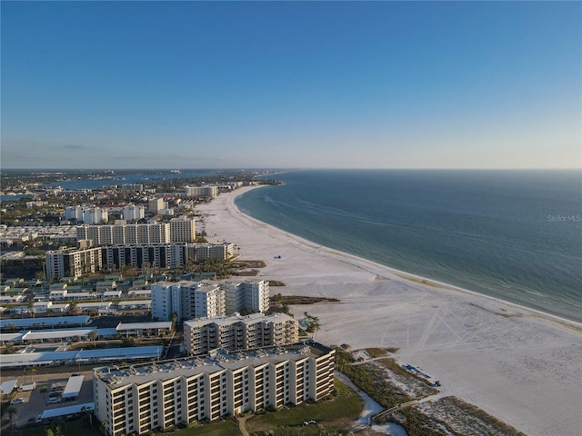 birds eye view of property featuring a water view and a beach view