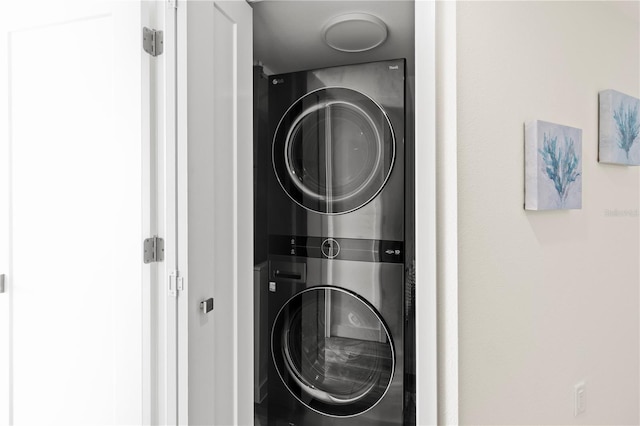 washroom with stacked washer and dryer