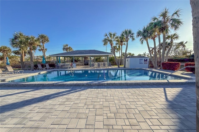 view of swimming pool featuring a patio area and a gazebo