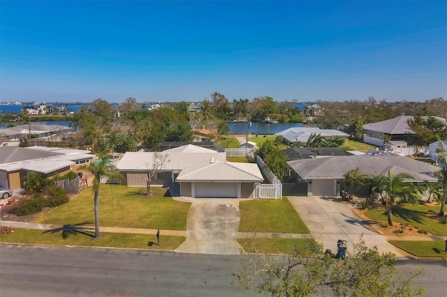 birds eye view of property with a water view