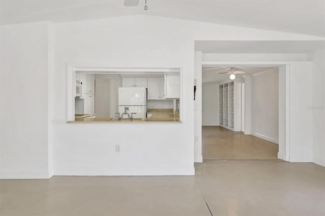 unfurnished living room with lofted ceiling and ceiling fan