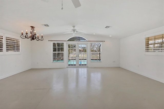 spare room with french doors, vaulted ceiling, plenty of natural light, and ceiling fan with notable chandelier