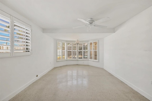 unfurnished room with ceiling fan