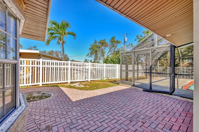 view of patio / terrace featuring a lanai