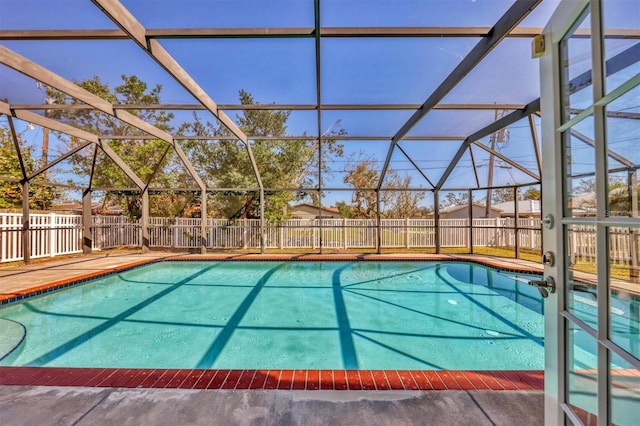 view of swimming pool with a lanai