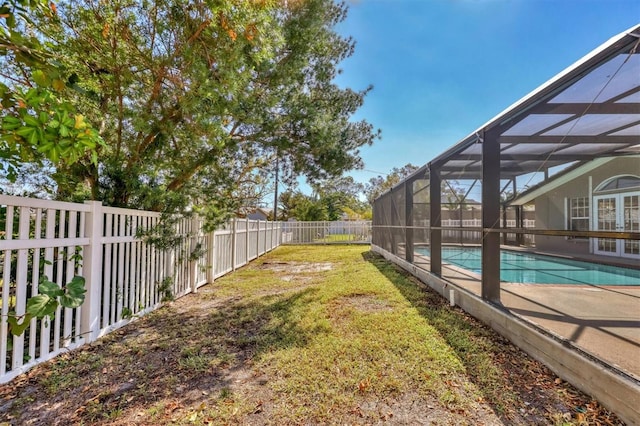 view of yard featuring a patio, a lanai, and a fenced in pool