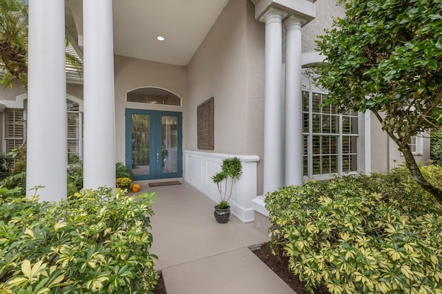 view of exterior entry featuring french doors