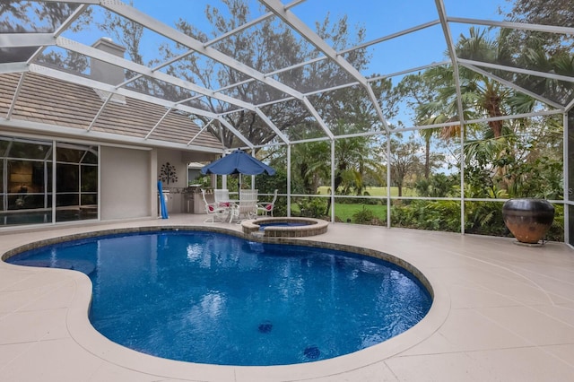 view of pool featuring glass enclosure, an in ground hot tub, and a patio area