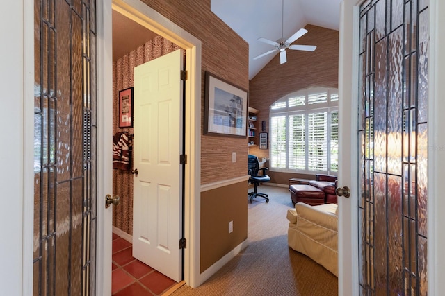 carpeted office space featuring ceiling fan and lofted ceiling