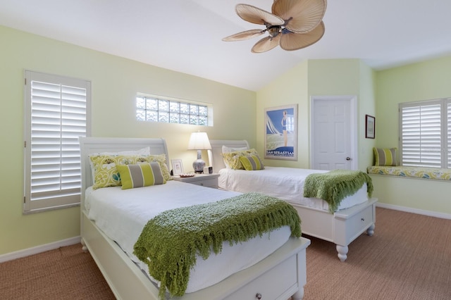 carpeted bedroom featuring baseboards, a ceiling fan, and vaulted ceiling