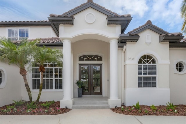 property entrance featuring french doors