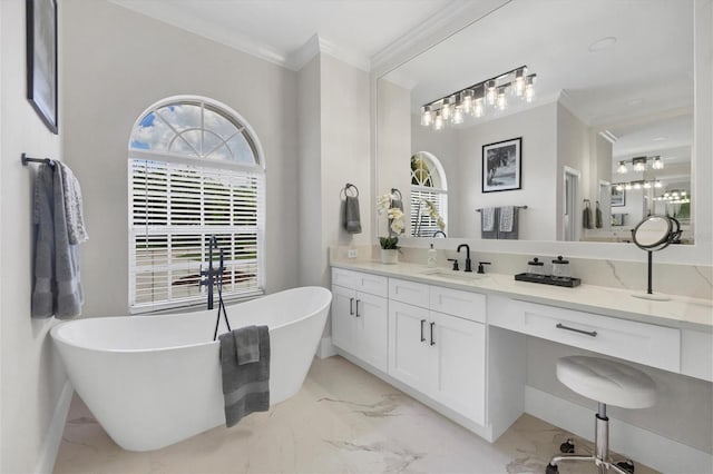 bathroom featuring a bathing tub, ornamental molding, and vanity