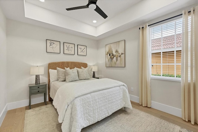 bedroom featuring hardwood / wood-style floors and ceiling fan