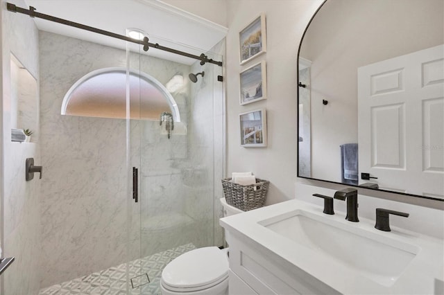 bathroom featuring vanity, toilet, and a shower with shower door