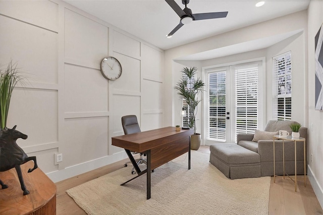 home office featuring light hardwood / wood-style floors and ceiling fan