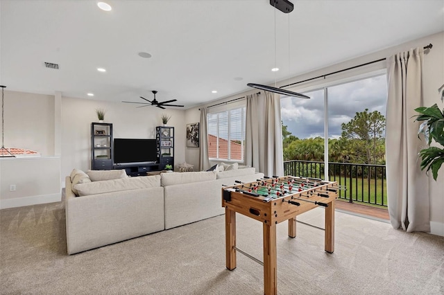 playroom with light colored carpet and ceiling fan