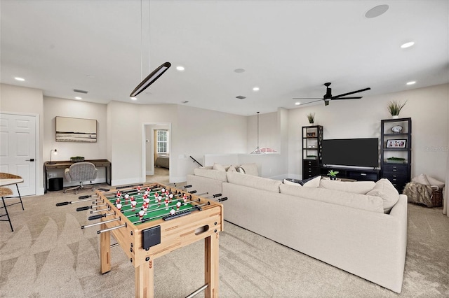 playroom with light colored carpet and ceiling fan