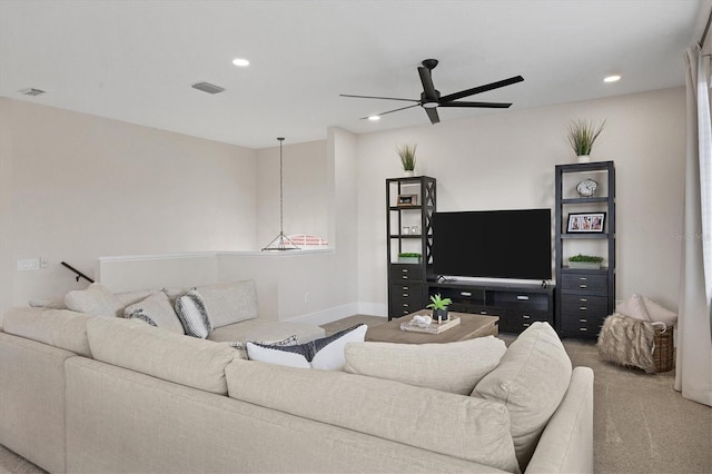 living room with carpet floors and ceiling fan