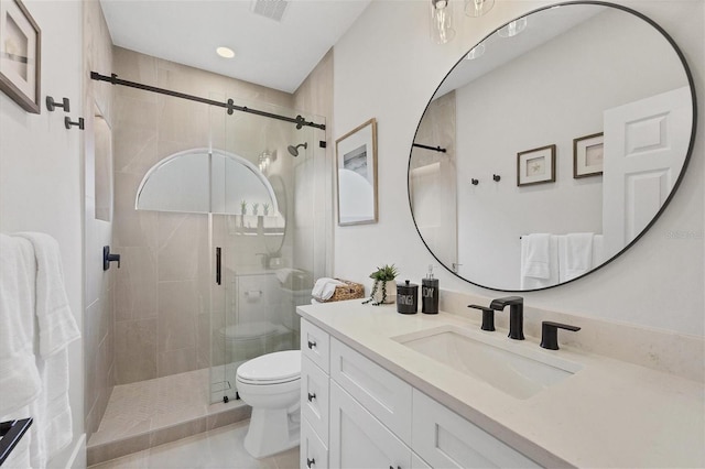 bathroom featuring vanity, toilet, tile patterned floors, and an enclosed shower